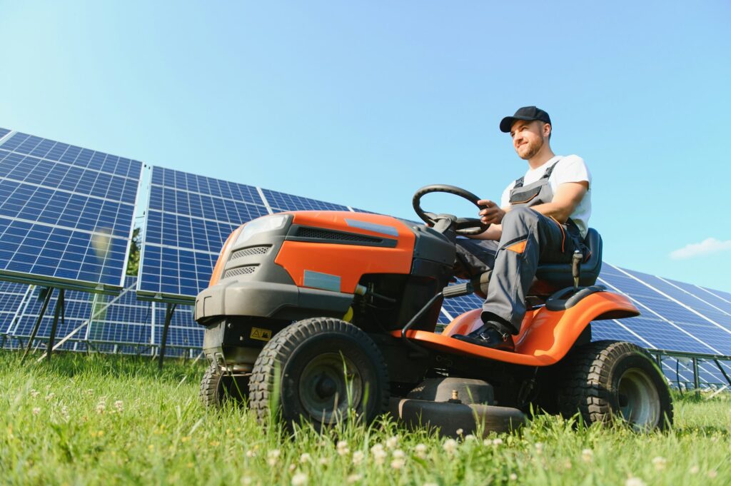 Riding Lawnmower mows the grass.