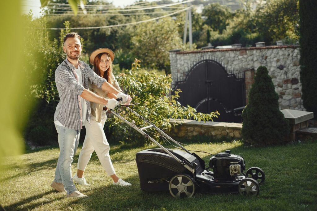 Push Lawn mower people working on the backyard