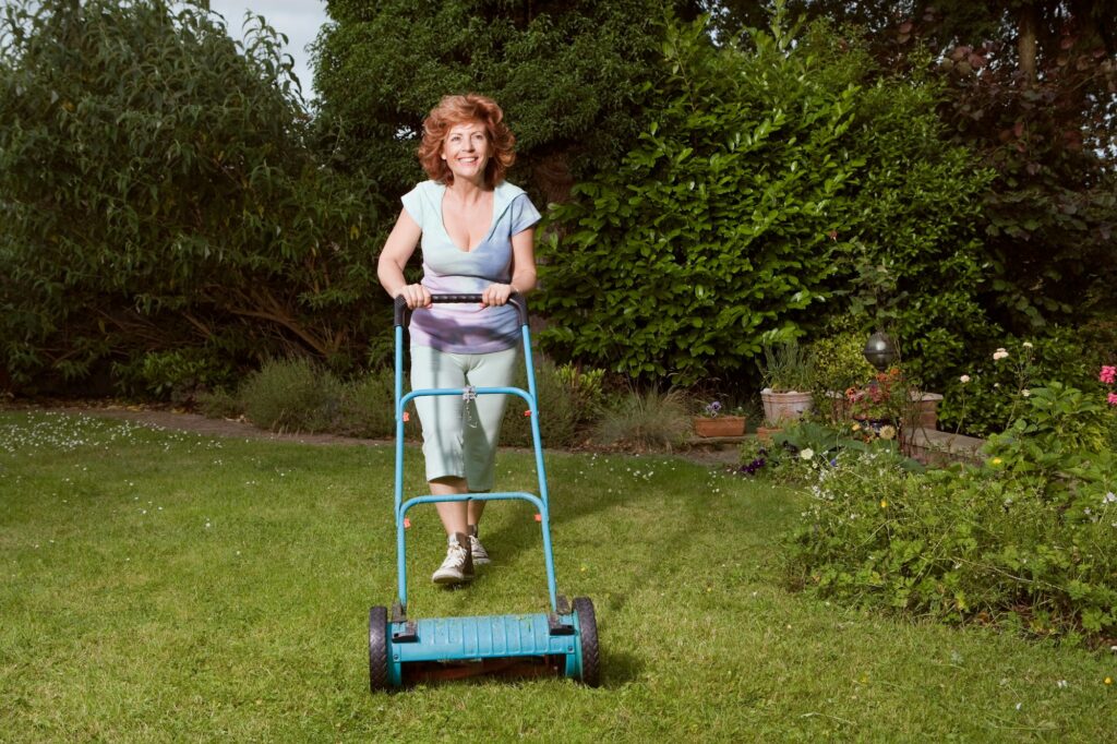 a reel mower mowing the lawn